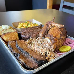 Get a little bit of everything. 2 Pork Ribs, Brisket, 1/4 Chicken (white or dark), Chopped Pork and your choice of 2 sides.