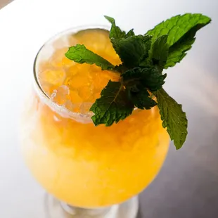 Puka Punch: Rums, lime, pineapple, orange, passion fruit, falernum, bitters, honey