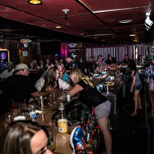 a group of people at a bar