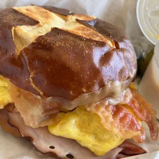 Breakfast sandwich. Egg, ham bacon and cheese.