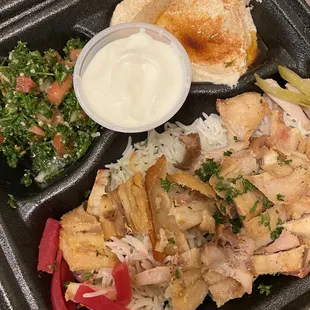 Shawarma Chicken dinner, with Tabouli Salad, Hummus and garlic sauce.