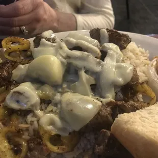 Cedars Dish. It&apos;s a lamb dinner over rice, but they fry up some of the mild peppers and a group of melty cheese, very very good