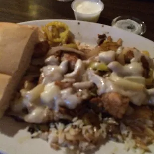 Oops! Started to eat before pictorial.  Marinated chicken over rice dish w/ Syrian Bread and garlic sauce. Delish!