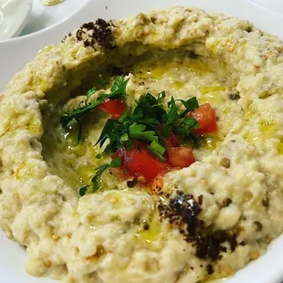 a bowl of hummusle and a bowl of dip