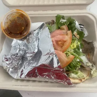 a sandwich in a styrofoam container