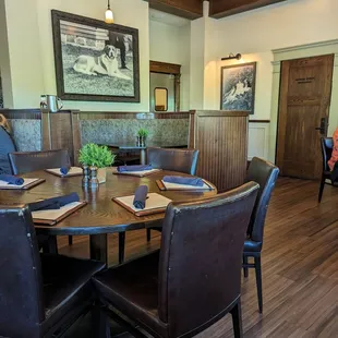 a dinning room with a table and chairs