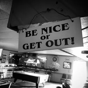 a be nice or get out sign