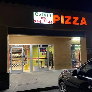 a car parked in front of a restaurant