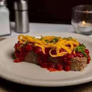 Award Winning Grass-Fed Meatloaf with tomato sauce, cheddar cheese and scallions, or mushroom sauce