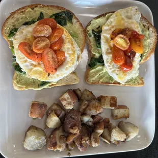 Avocado Toast (grilled Sourdough, avocado mash, sautéed spinach, eggs  your way topped with sautéed cherry tomatoes) and Breakfast Potatoes