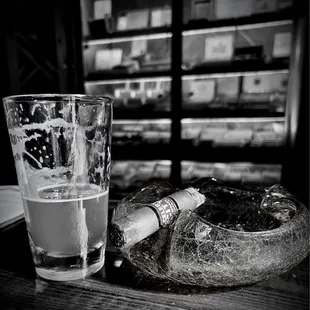 a cigarette and a glass of water