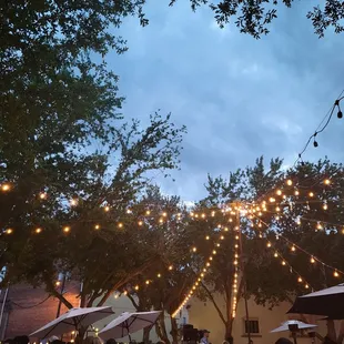 Sitting outside, beneath the lights