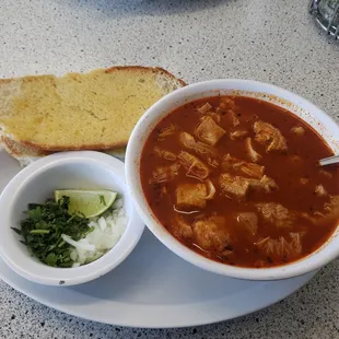 a bowl of soup and bread