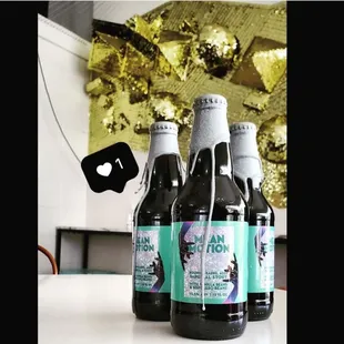 three bottles of beer on a table