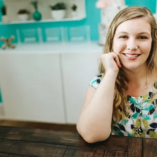a woman sitting at a table