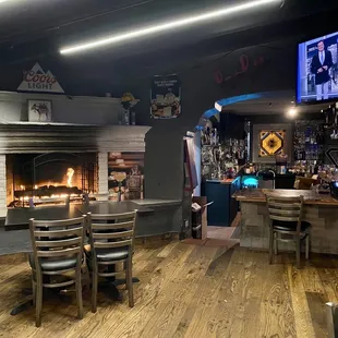 Small dining room, in between bar &amp; lobby, with fireplace