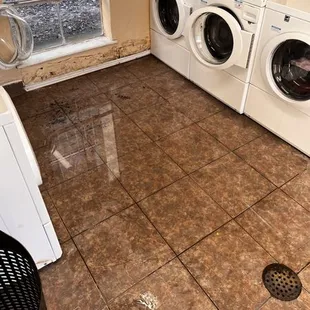 Flooded laundry rooms , very dangerous and high fall risk for all residents