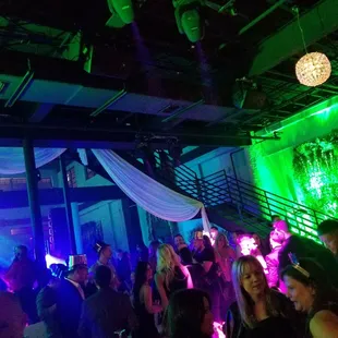 a group of people dancing at a party