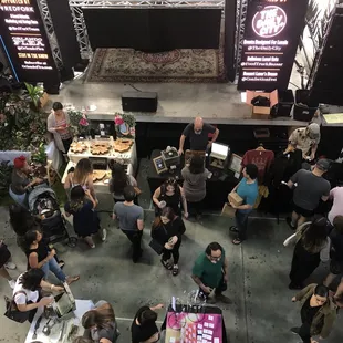 a crowd of people at a food show