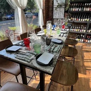 a long table with wine glasses on it