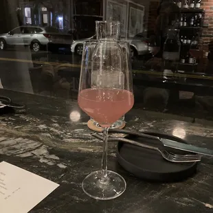 a glass of wine on a table