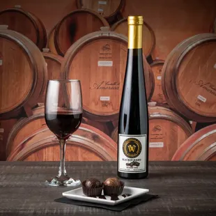 a bottle of wine and a glass of wine