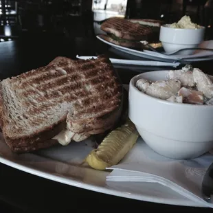 a grilled cheese sandwich with a side of potato salad