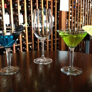 three glasses of wine and a lime slice