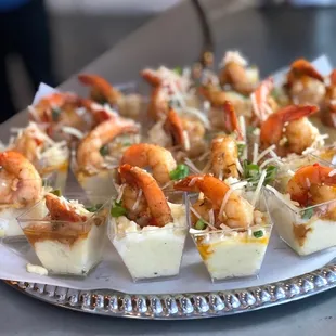 a platter of shrimp appetizers