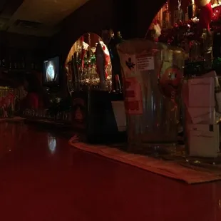 bottles of alcohol lined up on the bar