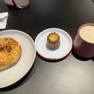 (From left to right) Za'atar, cheese, and onion bialy, canelé, and spiced butterscotch apple cider