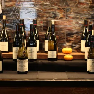 a variety of wine bottles on a counter