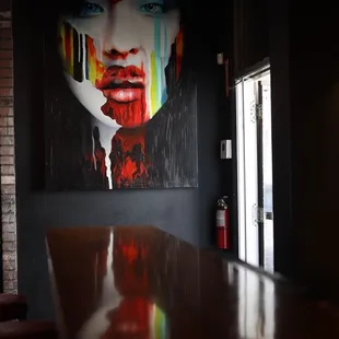 a woman's face painted on the wall