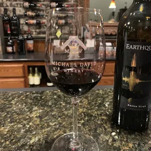 a glass of wine and a bottle of wine