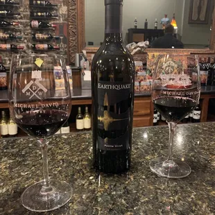 a bottle of wine and two glasses of wine