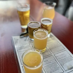 four glasses of beer on a table