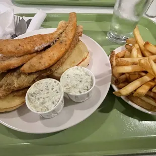 Filet Of Sole Sandwich with side of French fries. They don't pile on the fish like they used to and the fish these days isn't that great.