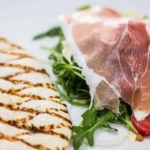 a plate of food with meat and vegetables