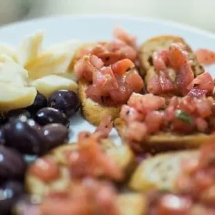 a plate of fruit and bread