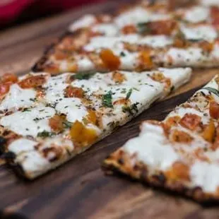 a slice of pizza on a cutting board
