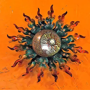a clock with a sun design on it