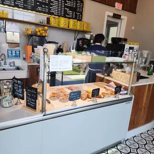 a woman standing in front of the counter