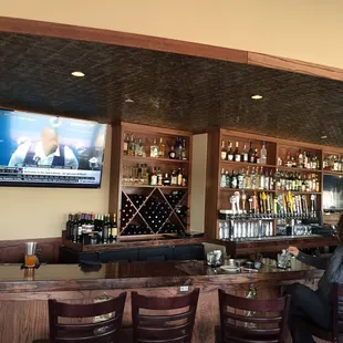 a woman sitting at a bar