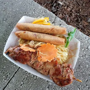 Lumpia, pancit, chicken on a stick