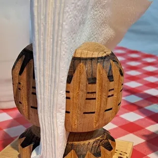 a napkin holder made from a wine barrel