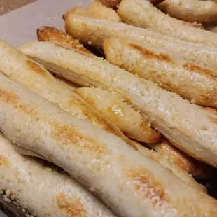 Fred bread : scrumptious bread sticks with garlic butter and Parmesan ( local favorite )