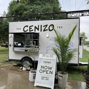 a food truck parked in the rain