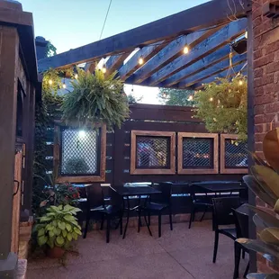 Outdoor seating, right off the stone oven where  they make the puzza!