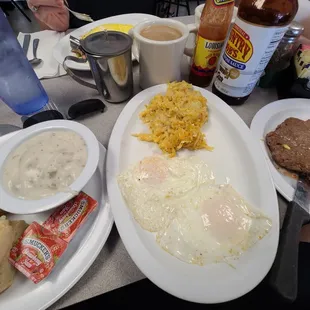 Hamburger patty breakfast with cheesy hash browns, two eggs over easy and B&amp;G. Wow!