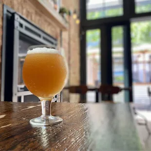 a glass of beer on a table